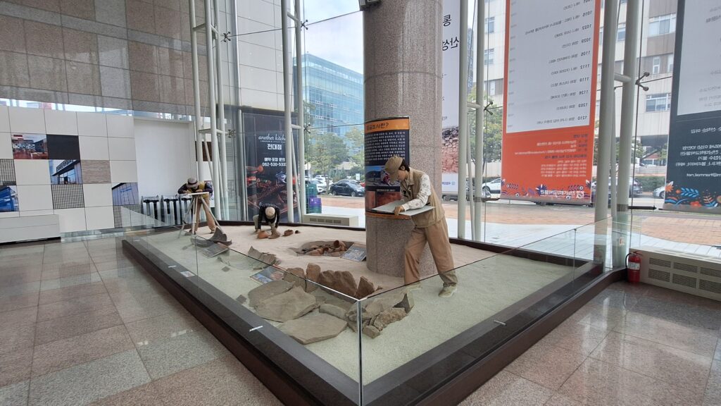 a model of a person at the entrance of the museum